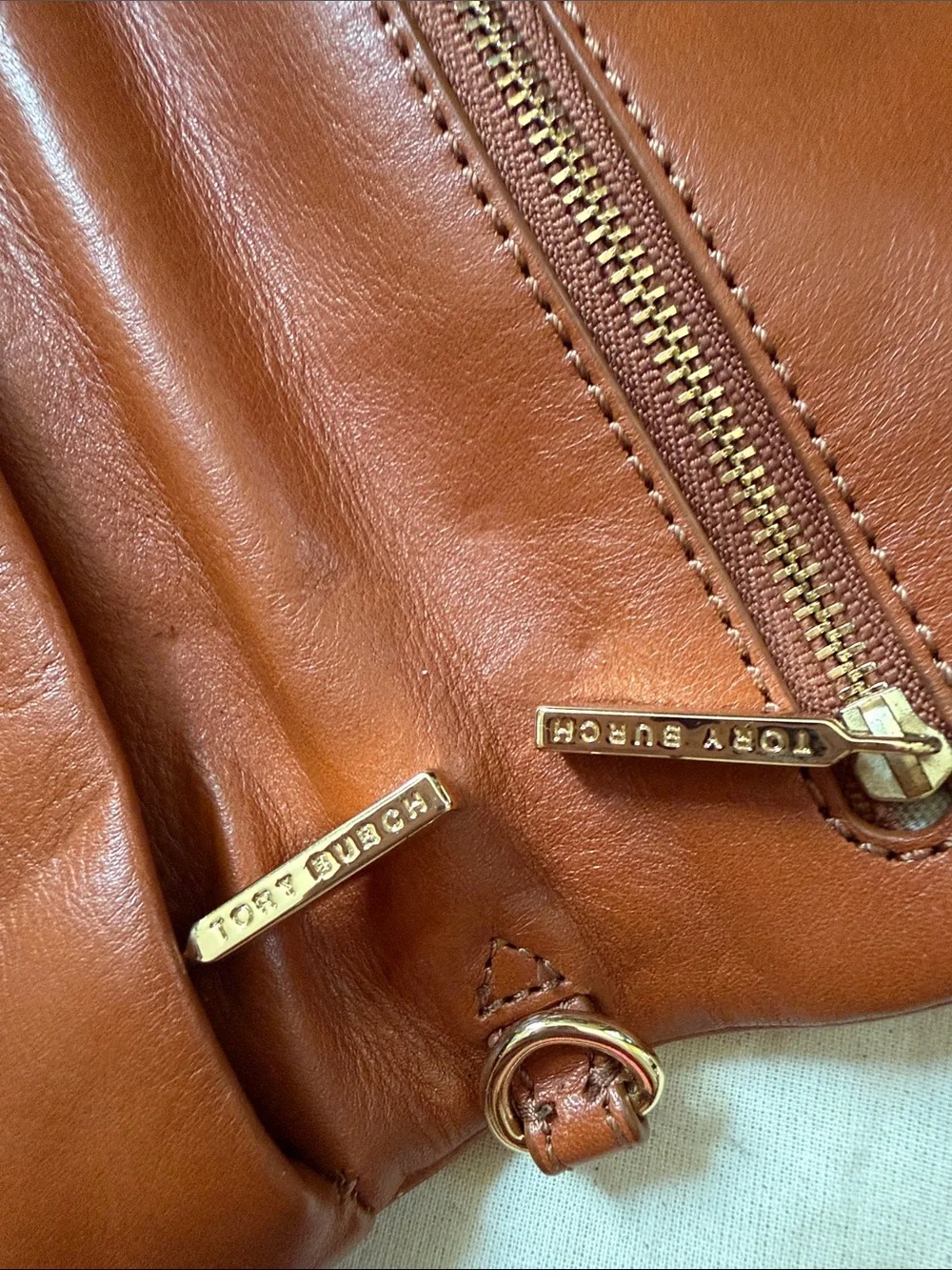 Tory Burch Reva Bombe Leather Clutch with Strap + Embossed Logo